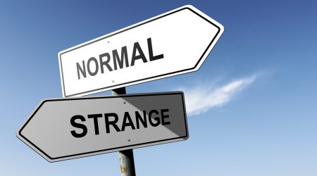 Normal and Strange directions.  Opposite traffic sign.